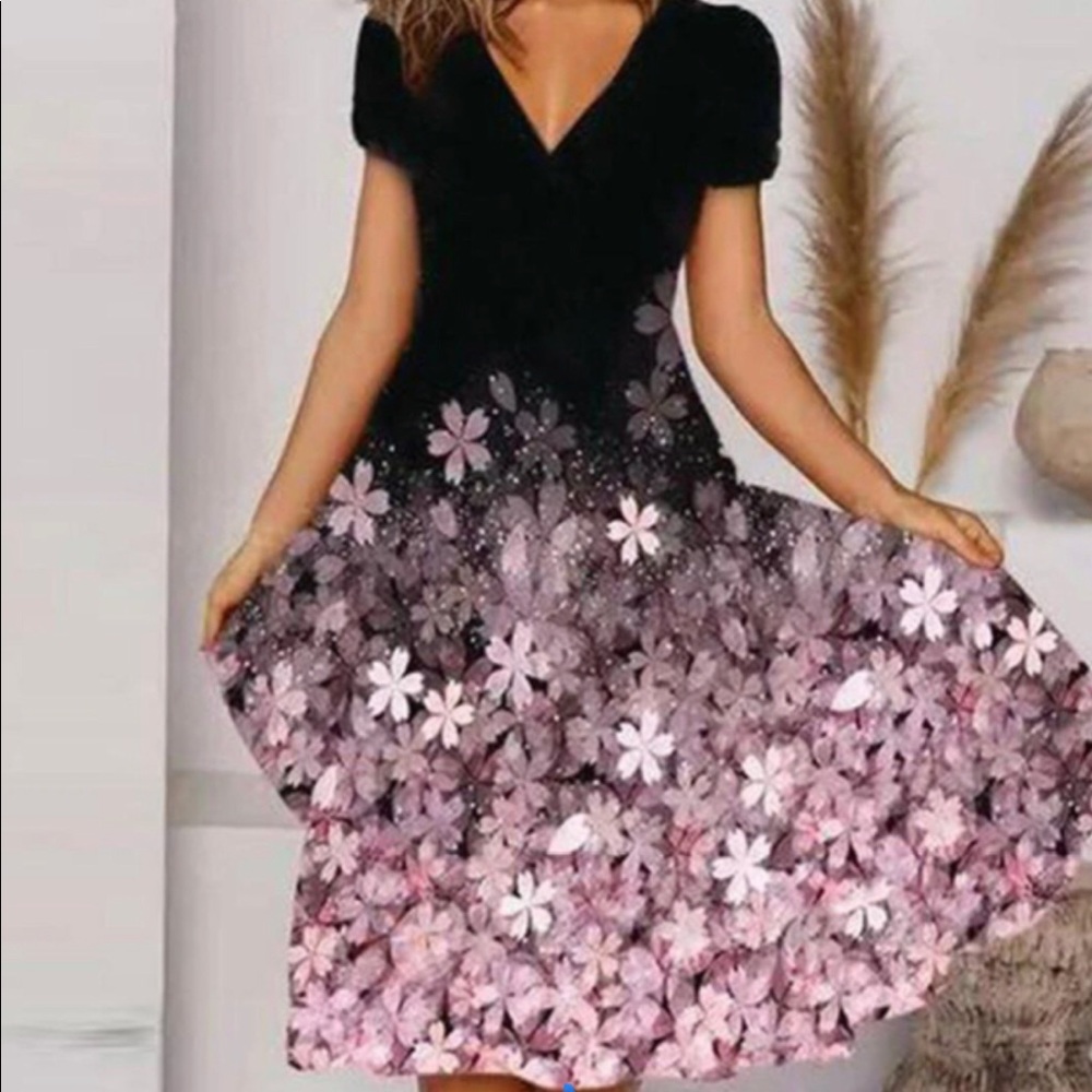 Tee length black dress with floral pattern